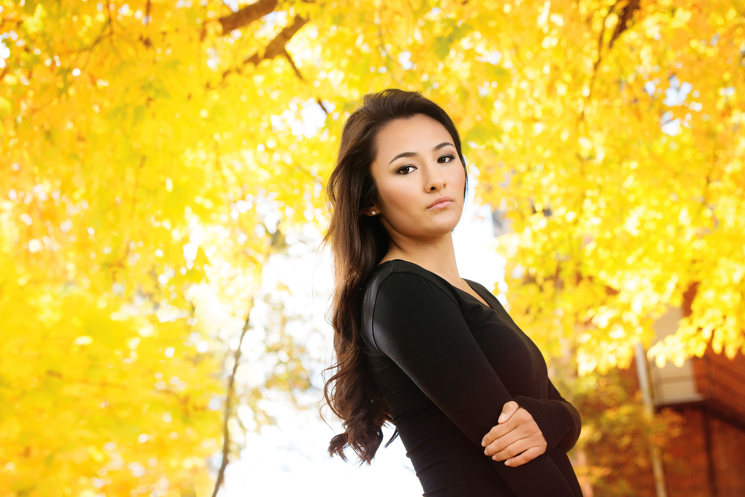 A Senior photo of Anthony Wayne High School student, Kelsey, posing with an Elephant at the Toledo Lucas County Fair.