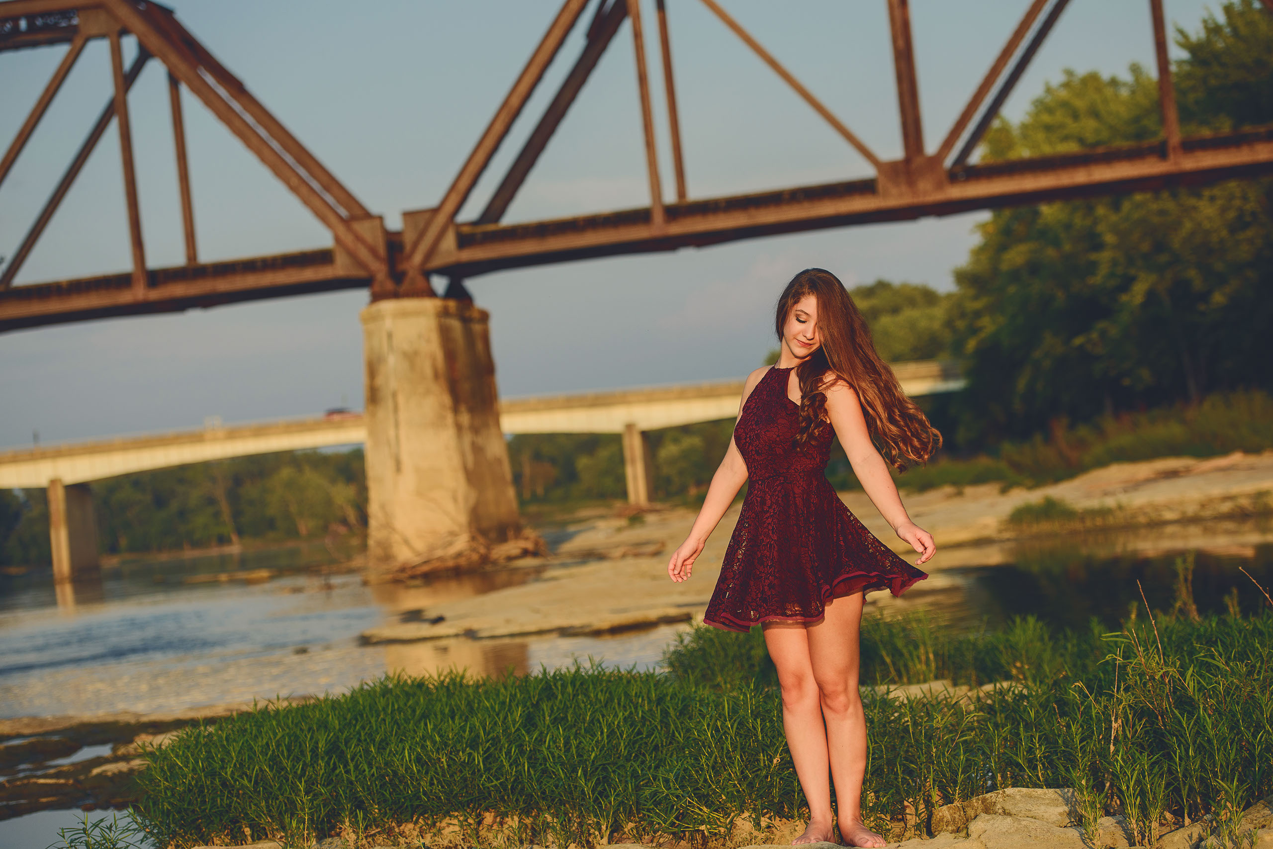 A Senior photo of Anthony Wayne High School student, Kelsey, posing with an Elephant at the Toledo Lucas County Fair.